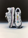 Pair of Salomon running shoes on a black and white background