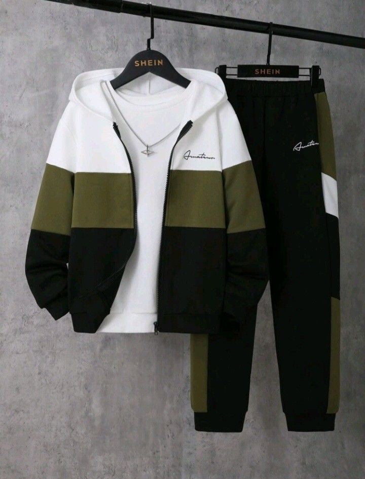 Two-piece tracksuit with a white, green, and black color scheme on a gray background.